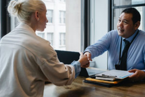 People shaking hands during consult
