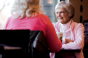 Older woman meeting with another person