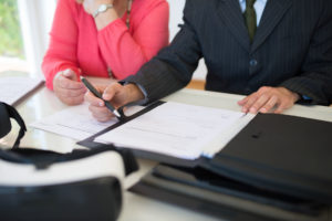 San Jose charitable planning attorneys. Couple looking over documents